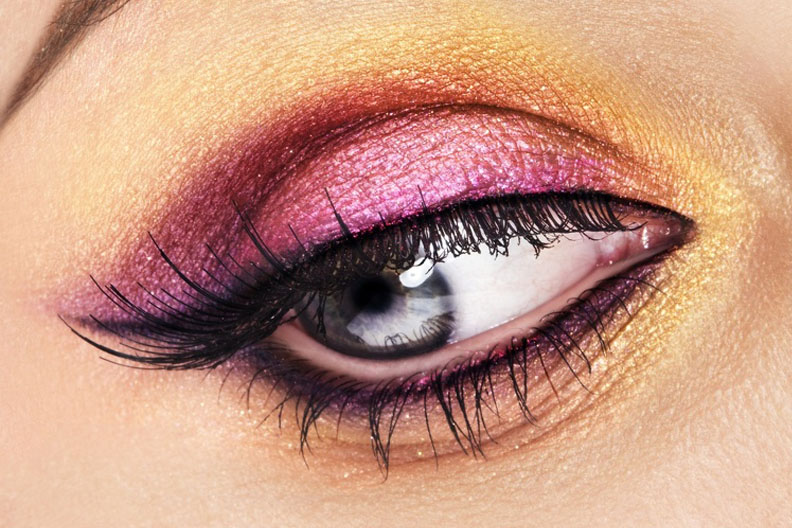 Eyelash extension procedure. Close up view of beautiful woman eyes with long eyelashes. Lengthening lashes for girl in a beauty salon. Beauty concept.